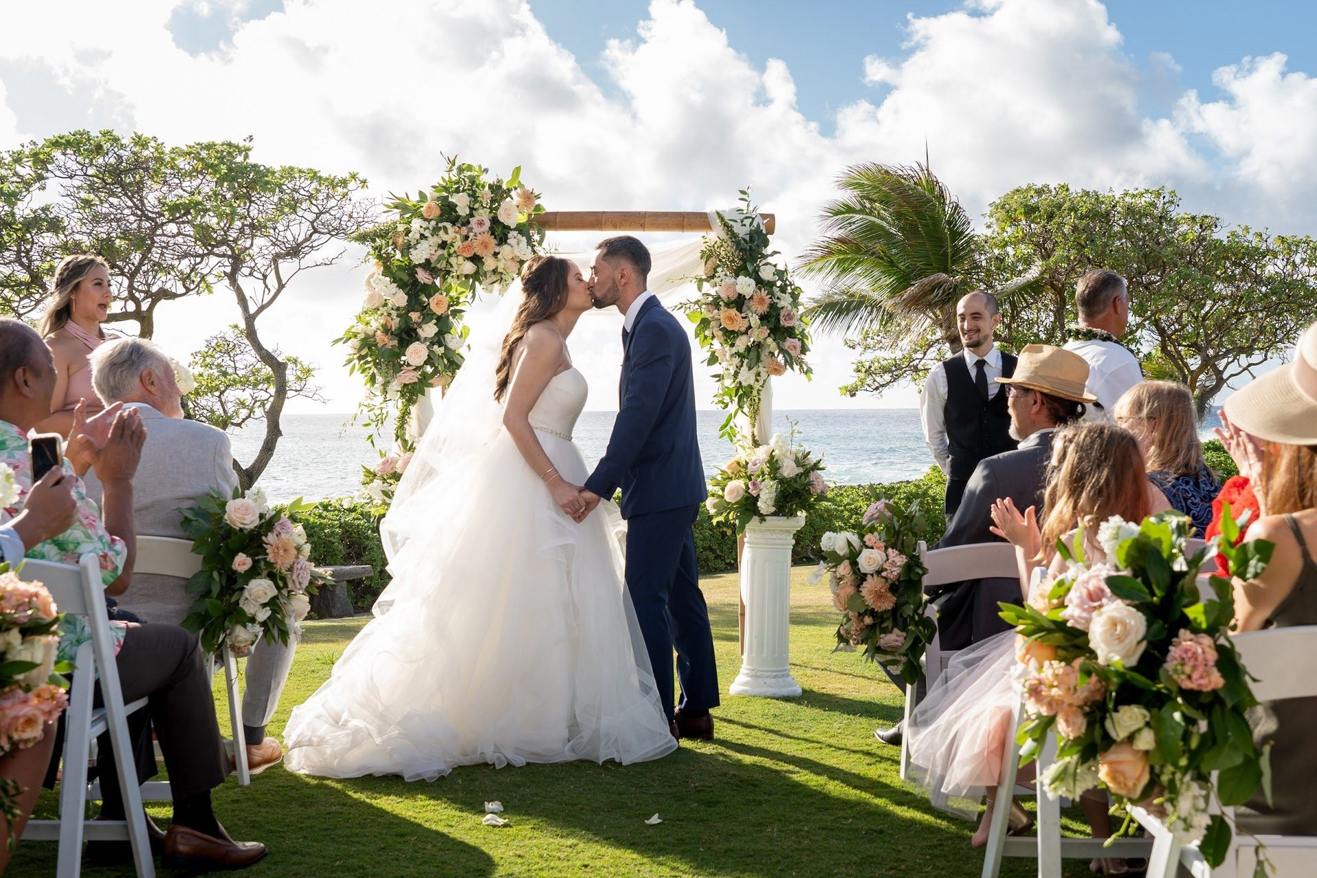 Bride walking into an outdoor ceremony among the guests